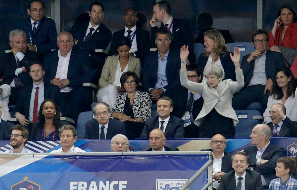  The PM failed to shore up her street cred when she screwed up a Mexican wave while watching England play France alongside Emmanuel Macron, days after her election disaster