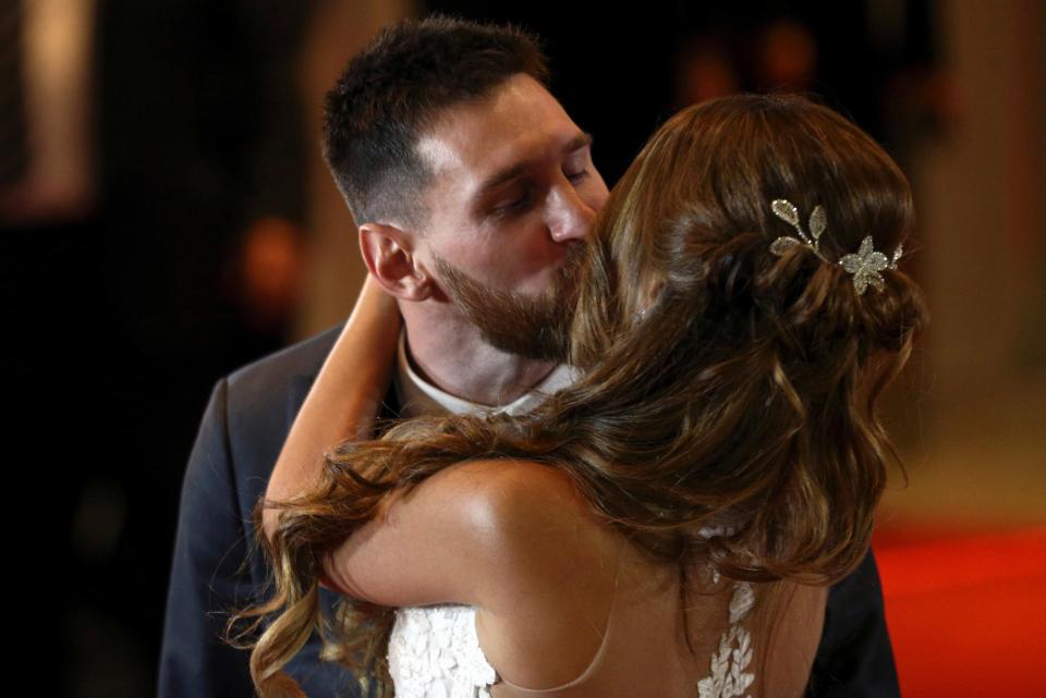 Lionel Messi and Antonella share a kiss after their wedding ceremony