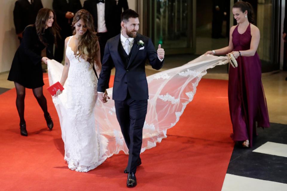 Lionel Messi gives the thumbs up after marrying childhood sweetheart Antonella Roccuzzo in Rosario, Argentina