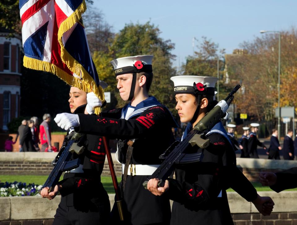  Royal Navy sea cadets marching in a procession of military cadets and officers to Beckenham war memorial on Remembrance Sunday