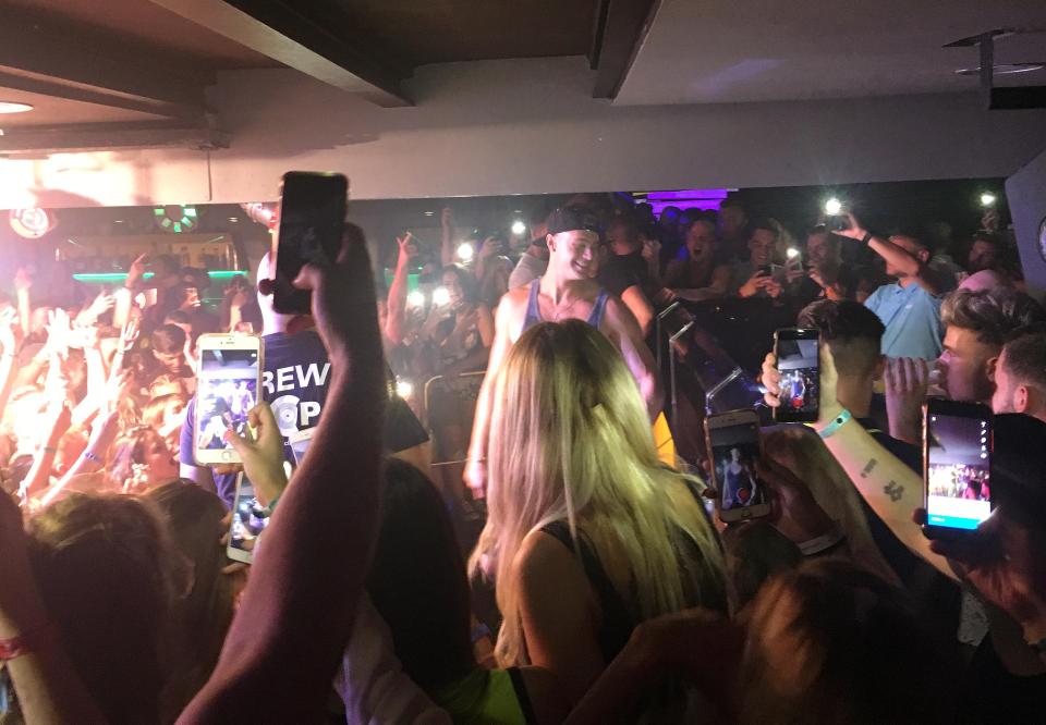  Geordie Shore's Scotty T performs at Magaluf's Bananas club encouraging drinking and slapping games