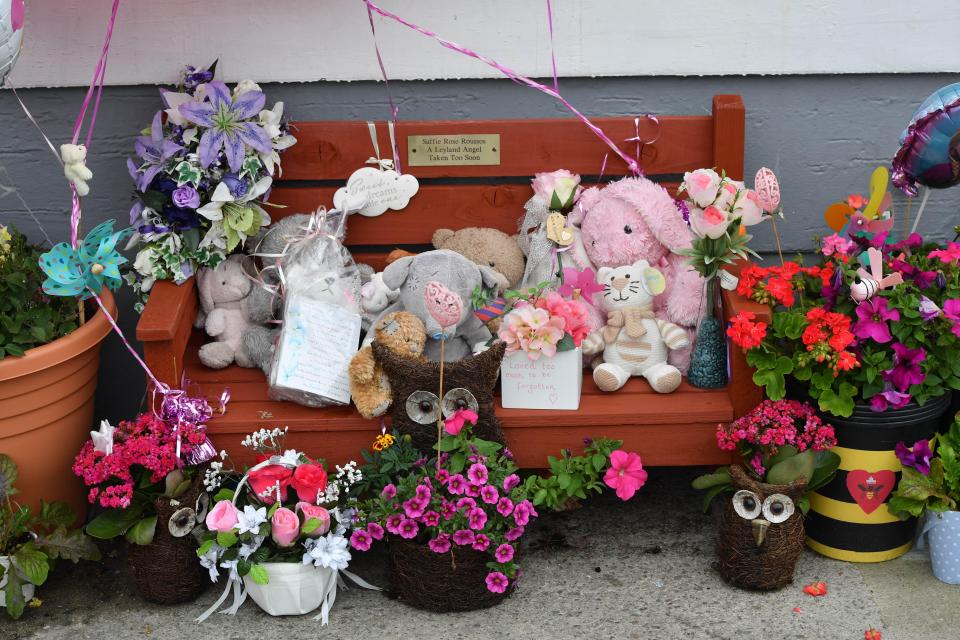  A memorial bench was created with stuffed toys and flowers in tribute to Saffie