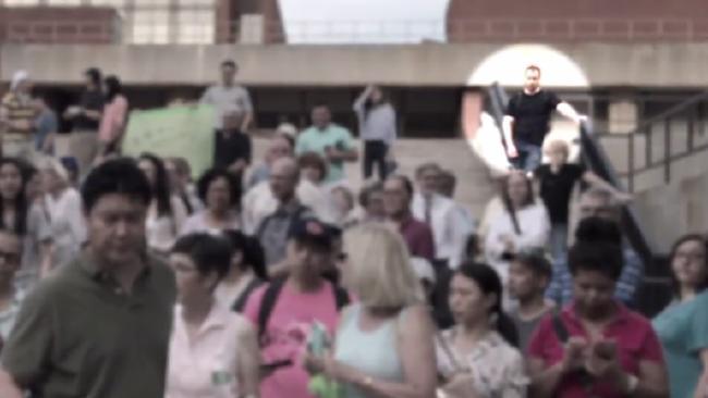  Suspect Christensen spotted in the crowd at a vigil for his alleged victim at the University of Illinois