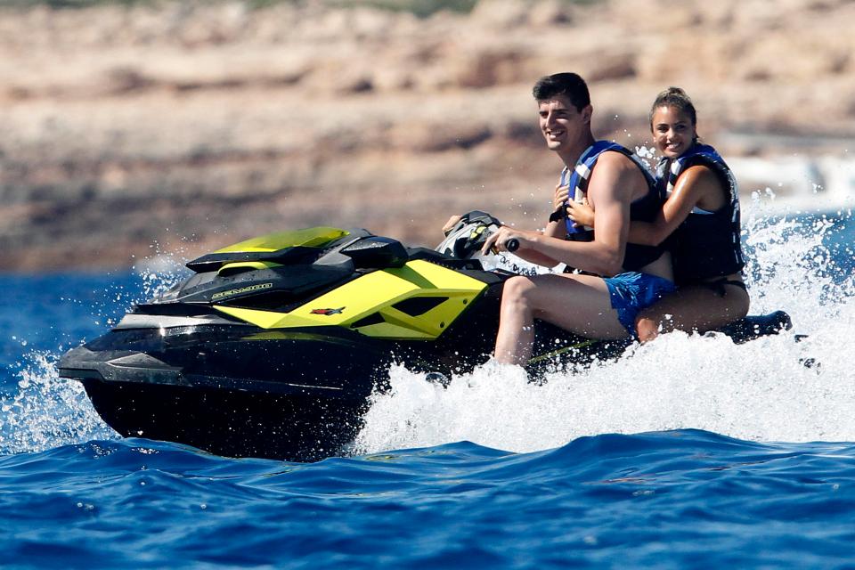 But the mystery woman was certainly clinging on tightly as Courtois took her for a spin on a jet ski