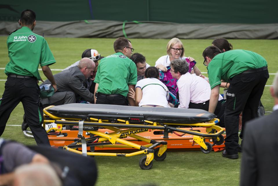  A number of medics and Wimbledon staff rushed to help the stricken player