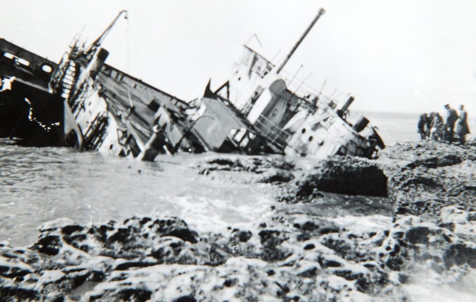  A shipwreck on the beach in La Panne with boats lying destroyed after 330,000 Allied troops had been rescued from the beaches