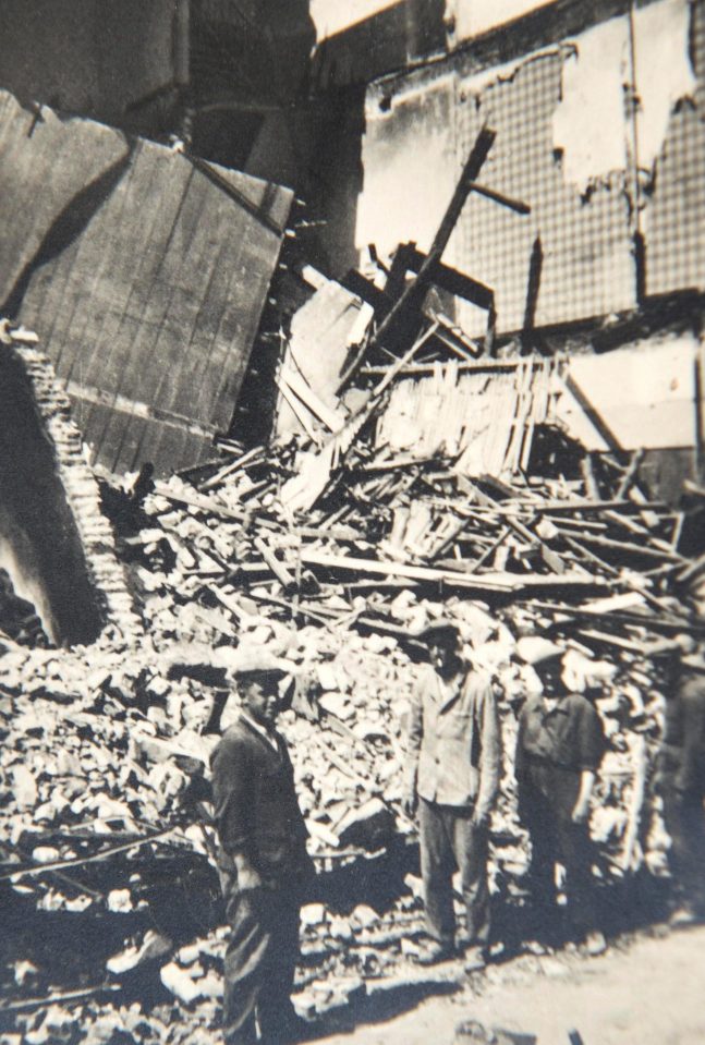  Locals inspect damage to a house in Ostend, which lies in complete ruin