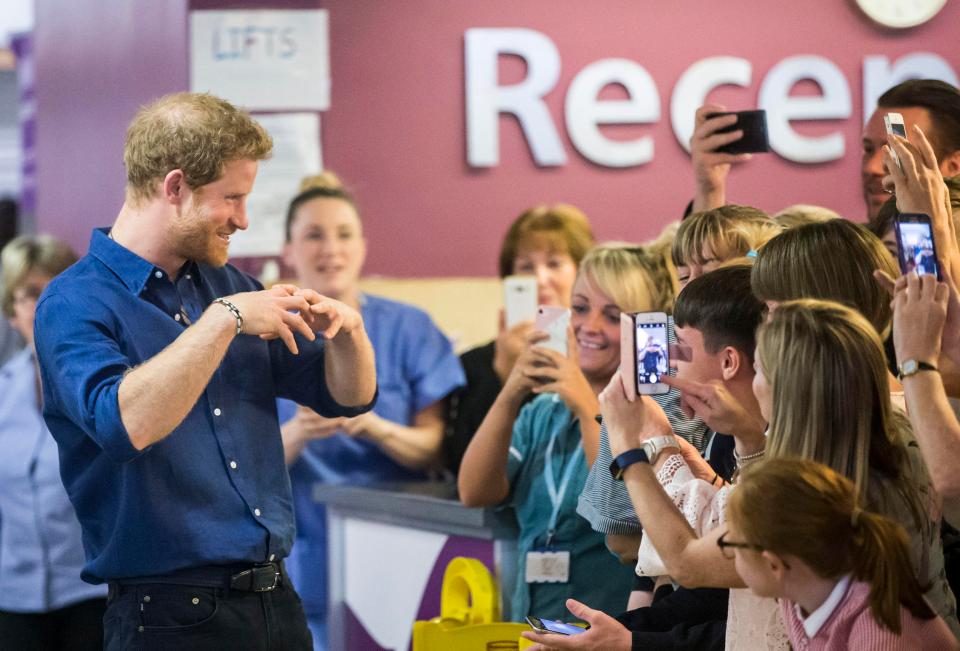  Harry happily posed for snaps for hospital staff and patients