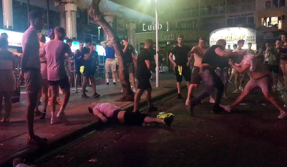  A young lad lays unconscious after being knocked out by a bouncer outside the Magaluf nightclub