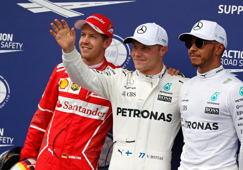  Sebastian Vettel (left), Valtteri Bottas (centre) and Lewis Hamilton (right) posed for pictures