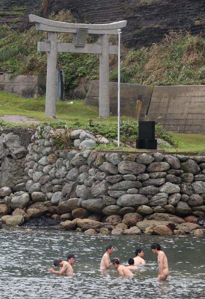  A group of naked men under go a purification ritual on Okinoshima