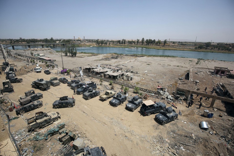 Iraqi forces gathered in a position near the Tigris River where jihadi were seen jumping into 