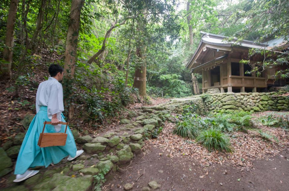  A Shinto priest pictured on his way to perform a purifying ritual at an ancient shrine