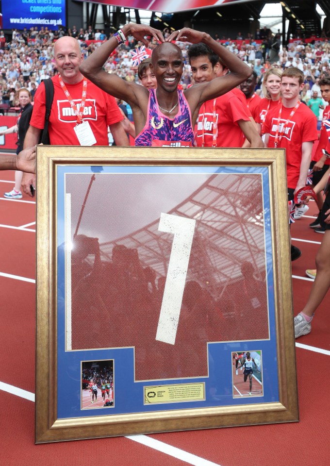 Mo Farah is presented with a piece of the London Stadium track after his triumph