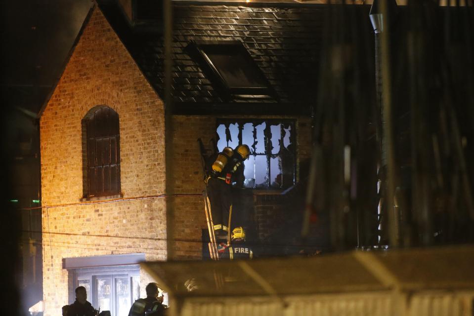  Firefighters were seen inspecting gutted market units