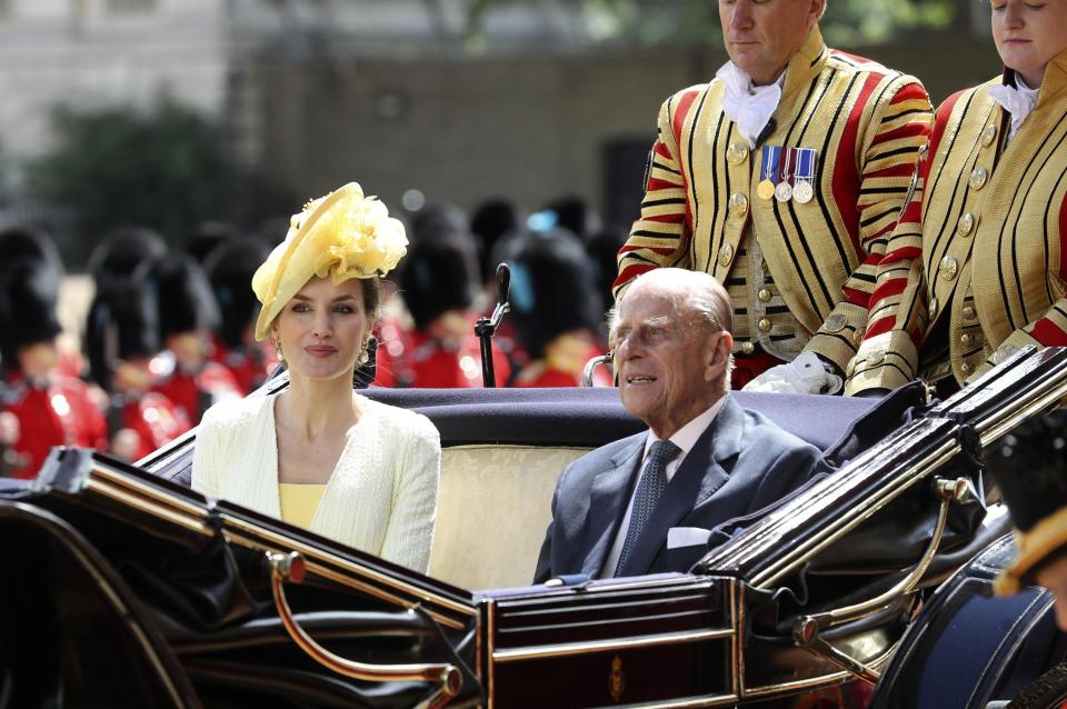  Queen Letizia chats to Prince Philip in a state carriage following the horse parade