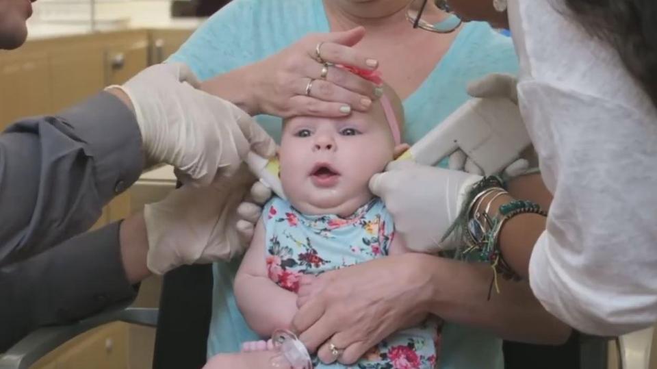  The unidentified baby looks pretty calm at the beginning of the clip