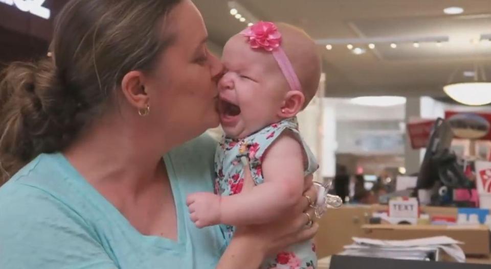  The mum attempted to comfort her baby after the quick procedure