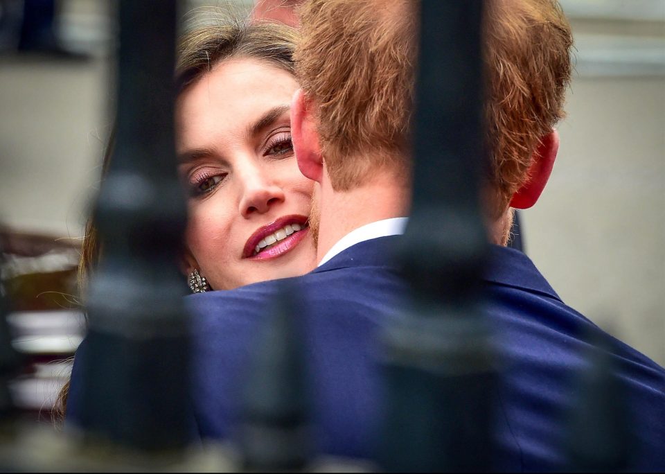  Prince Harry leans in for a smacker as he greets Spain's Queen Letizia at Westminster Abbey today