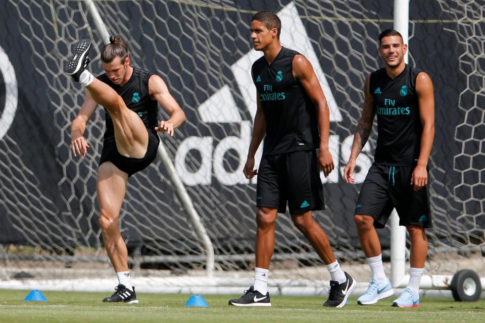  Gareth Bale stretches during the training session