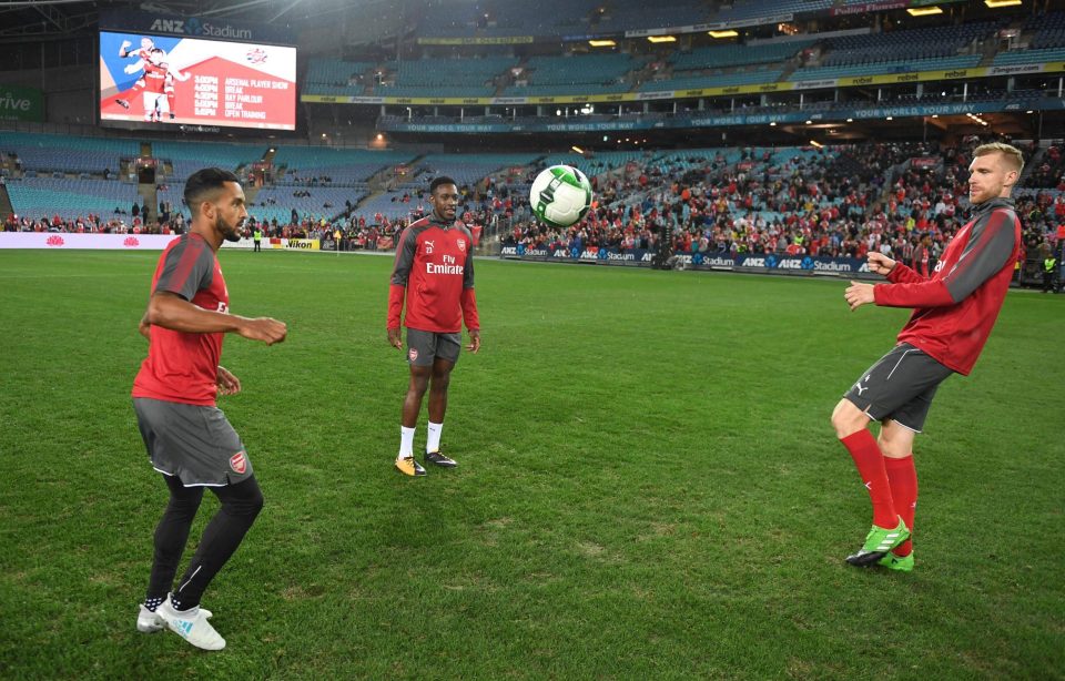  Walcott, Danny Welbeck and Per Mertesacker knock the ball around