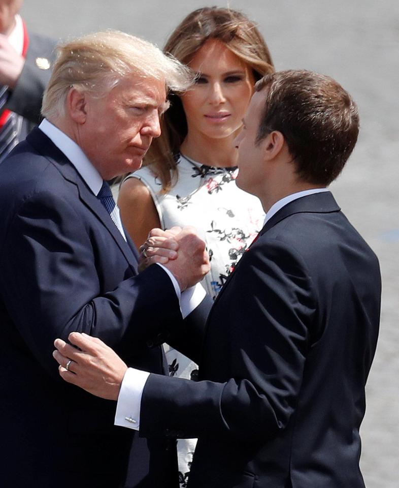  The two powerful leaders gripped each other's hands for nearly 30 seconds back in 2017, at a military parade in Paris