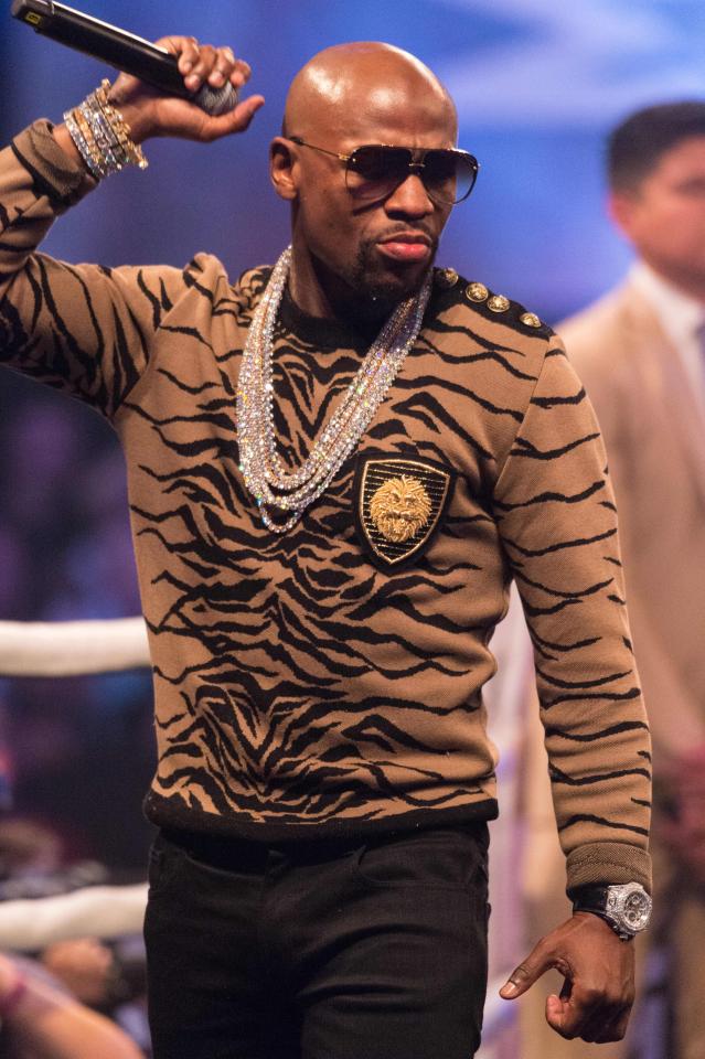  Mayweather, who was wearing a leopard print jumper and a sparkling set of chains, pictured before the prang