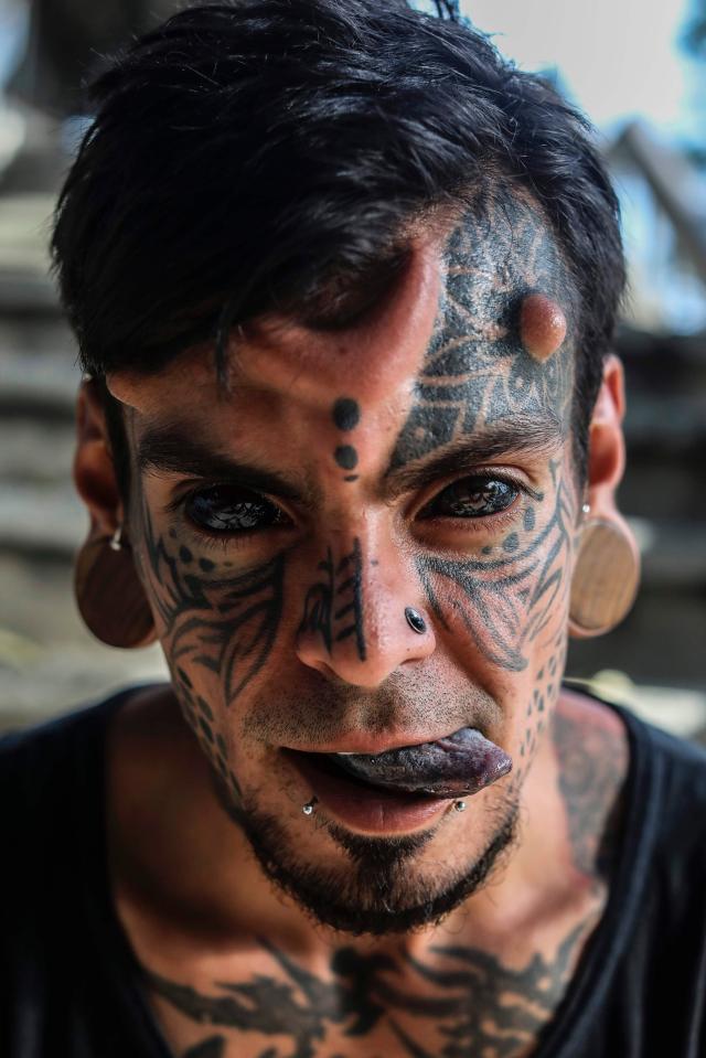  The Colombian also has his TONGUE tattooed as well as huge stretched ear lobes