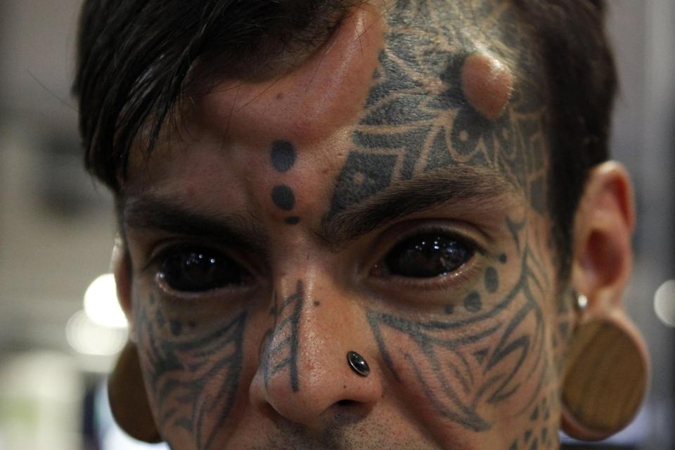  Carlos Dehaquiz is a 'professional freak' - and has horns and tattooed eyeballs