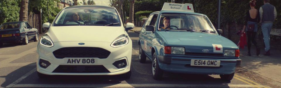  The commercial sees Keeley drive past herself as a learner