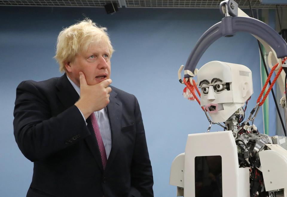  Boris Johnson was pictured with a robot at Tokyo's Waseda University