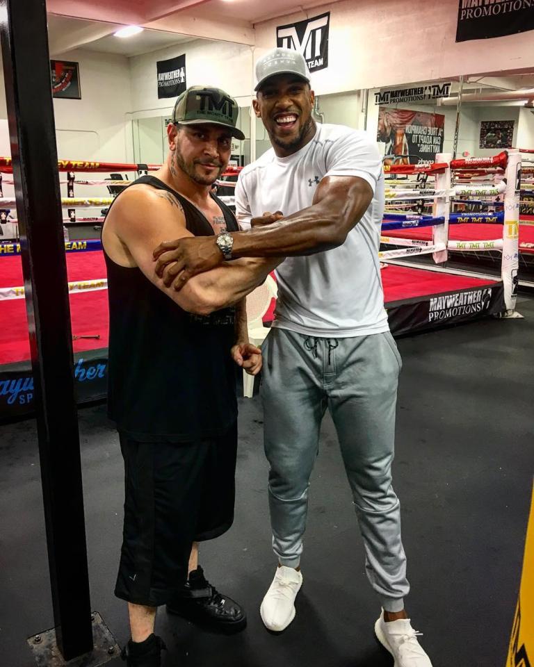 Joshua was happy to pose with other members of The Money Team at the gym