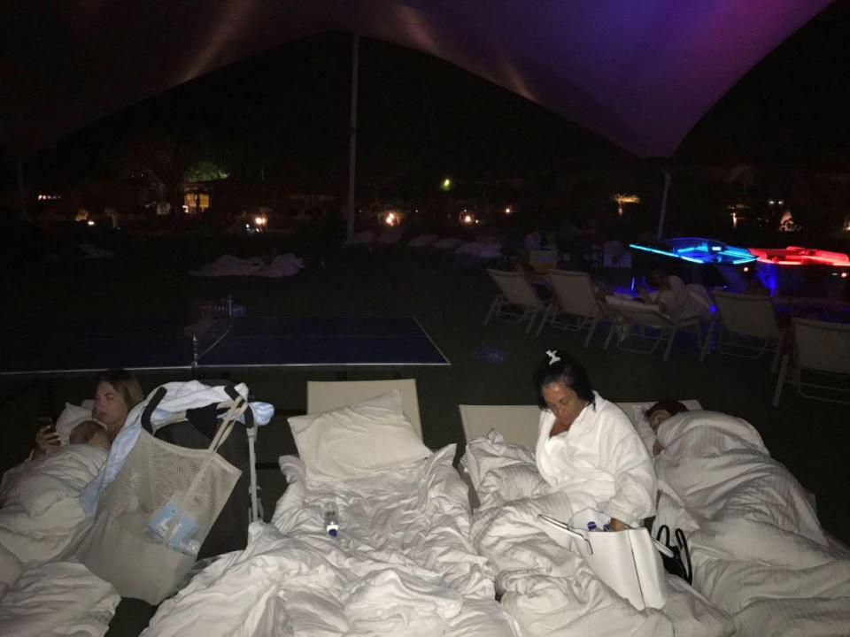 Brits bed down on sun loungers after being evacuated from their hotel in Kos