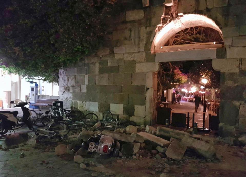  Mopeds and bicycles are seen crushed under rubble in Kos