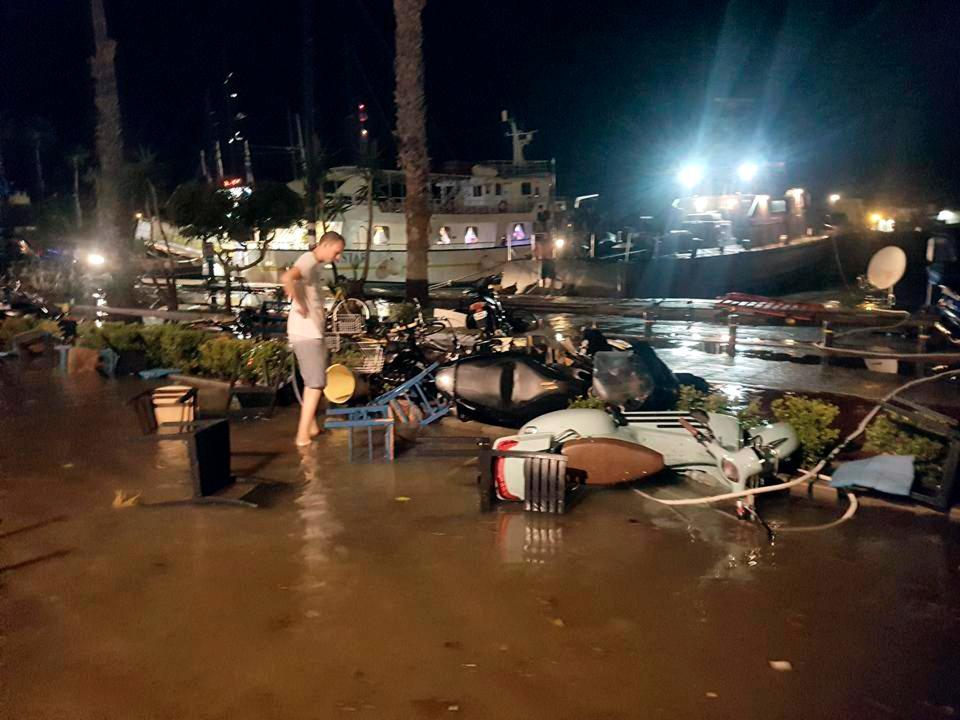  Damage and flooding are seen on a coastal road in Kos