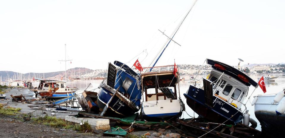  Damaged boats are seen on a beach following in the Agean coastal city of Mugla