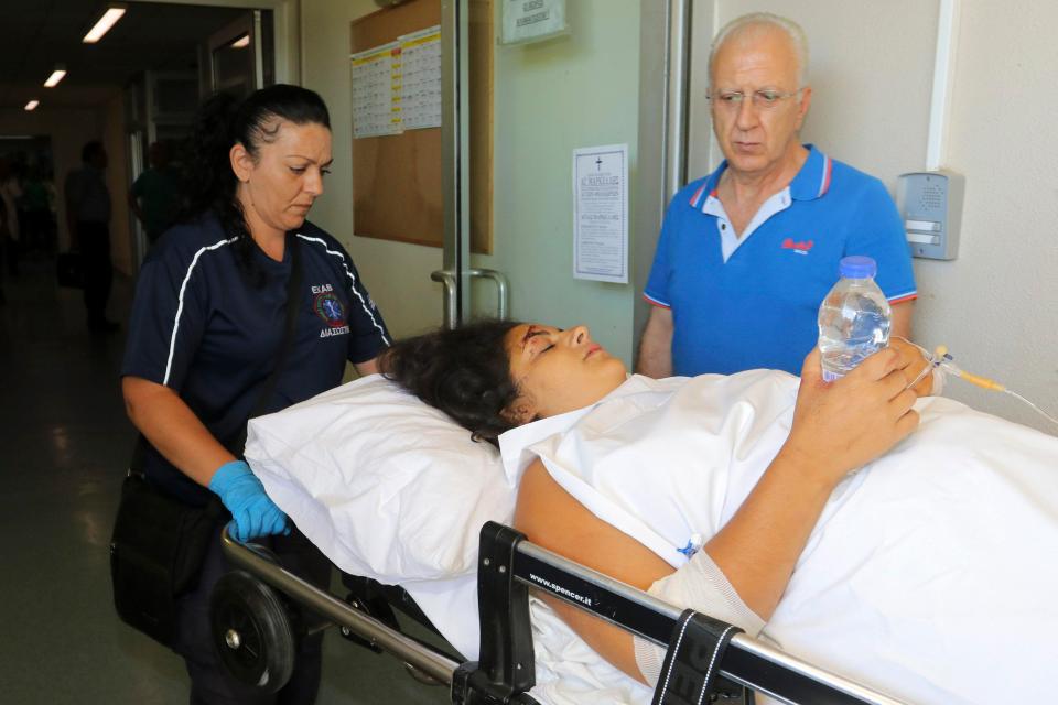  Medics transfer a woman off the island of Kos to the hospital of the city of Heraklion on Crete