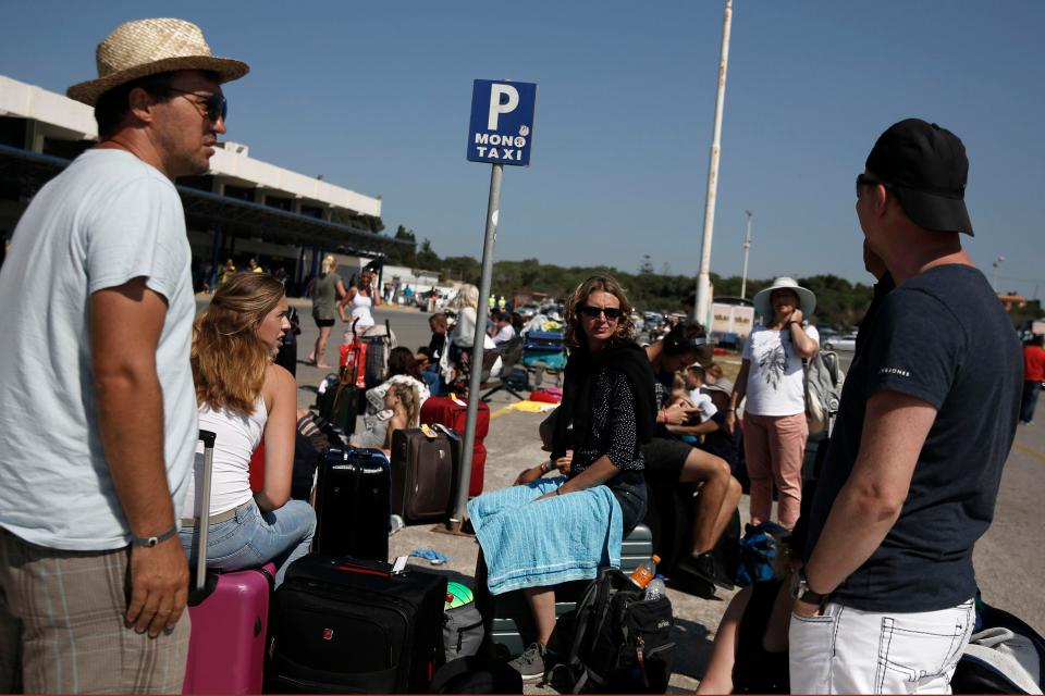  Tourists were seen gathering outside the airport in Kos as they prepared to flee the holiday island