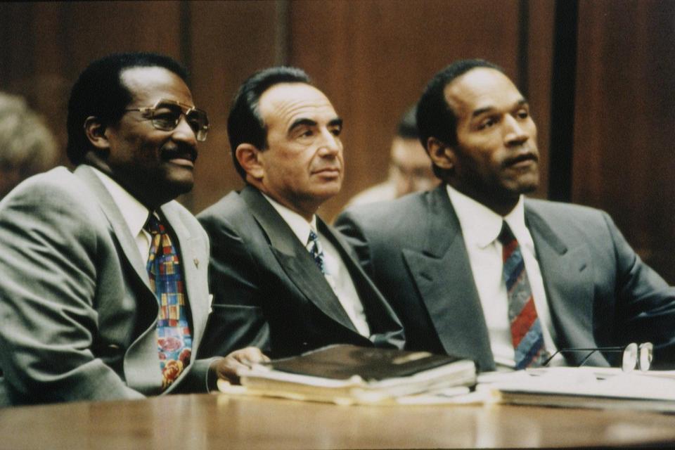  Heavy-hitting lawyers Johnnie Cochran (left) and Robert Shapiro (centre) alongside their high profile client