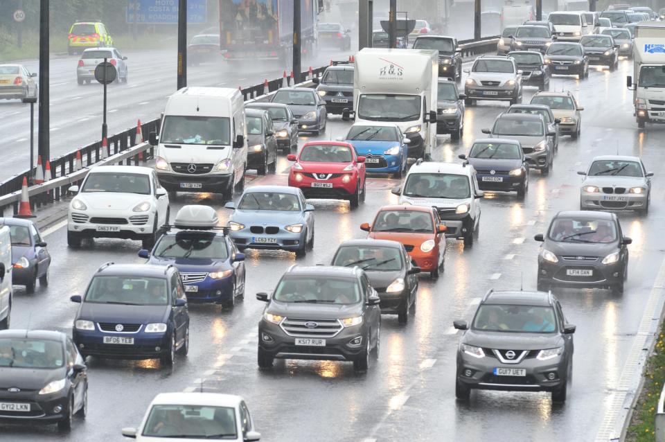  The slow rain ... the weather caused delays on the M25 at Dartford, Kent