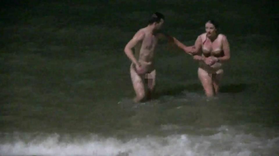  Two British tourists were arrested after they were caught naked in the sea