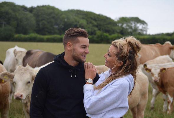  The couple posed for pictures in front of Chris' beloved cows