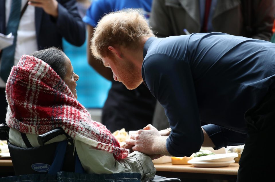  Caring Harry broke royal protocol by holding the hand of an elderly woman with Myeloma cancer.