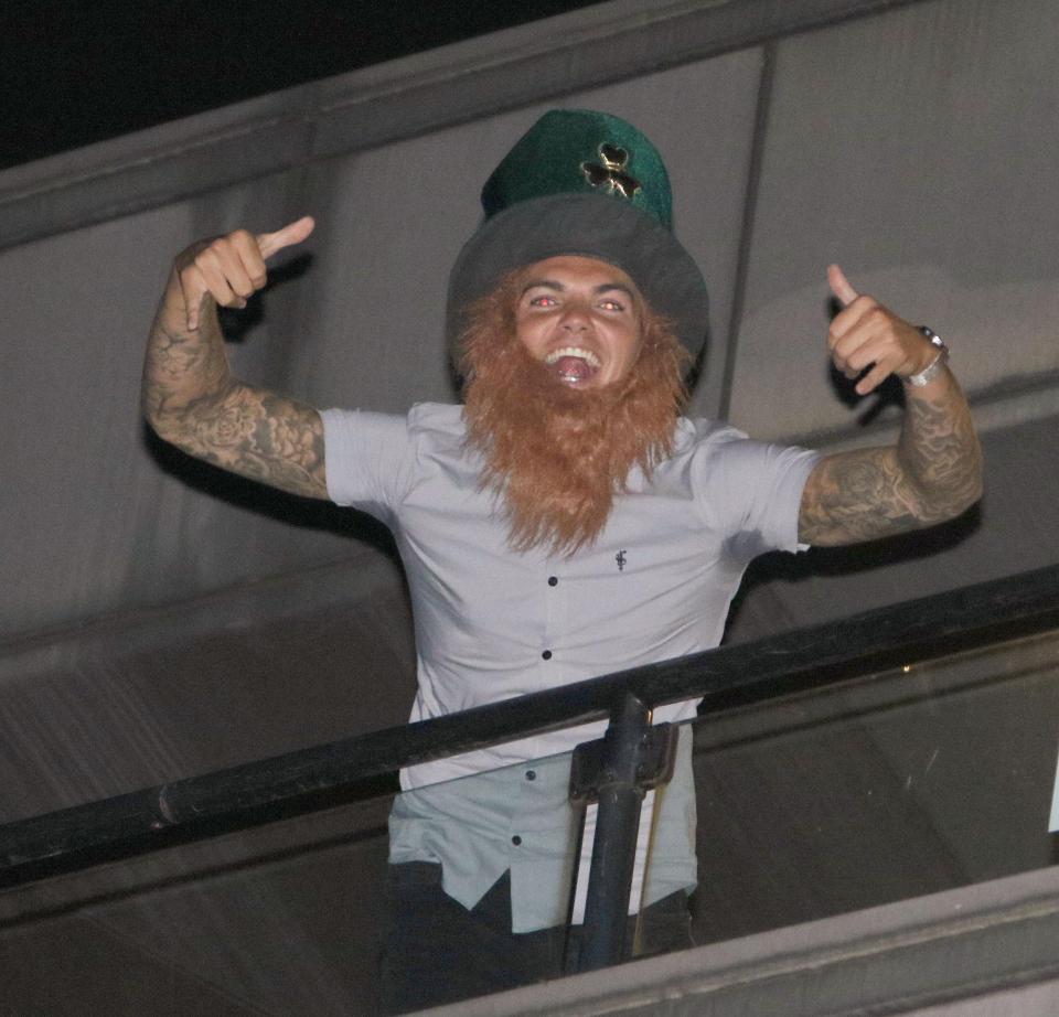  Samgave a thumbs-up as he embraced the Irish theme in a top hat and beard