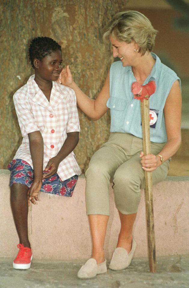  Gentle touch...  stroking the face of landmine victim who had a leg blown off