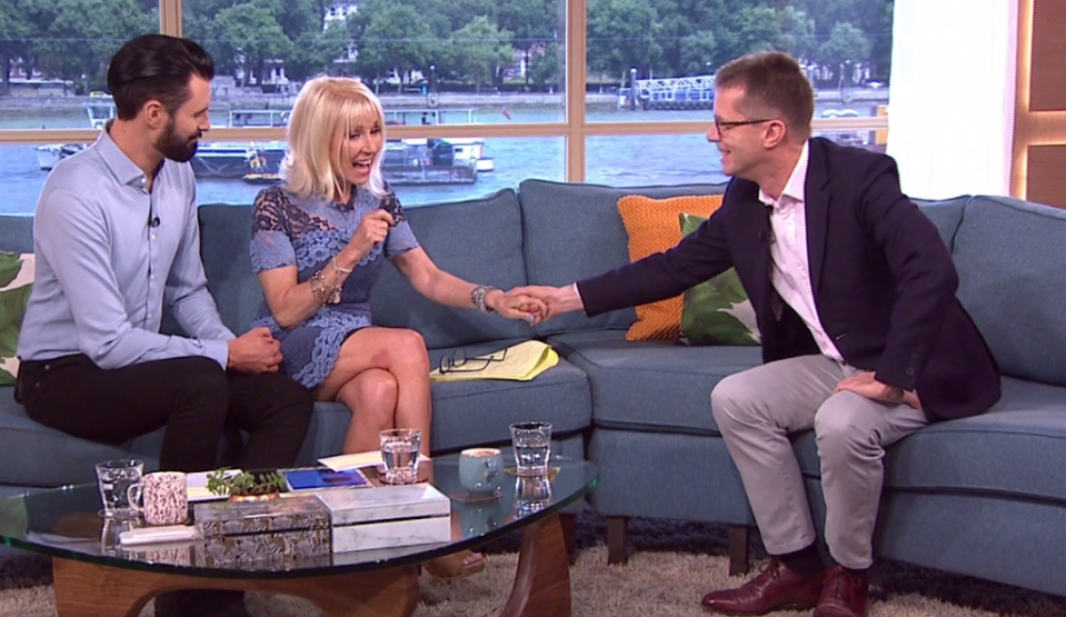  Nicky held Sarah's hand as she continued with the interview