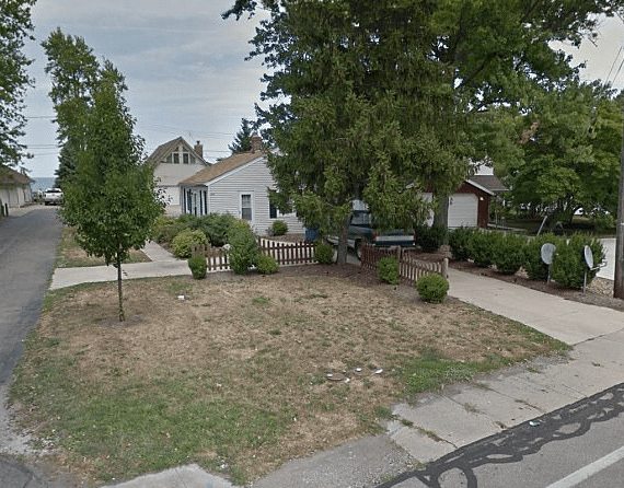  The woman was found lying in her driveway of her home (above) in the town of Sheffield Lake