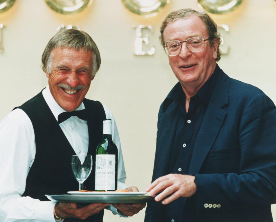  Sir Bruce helping out in the canteen at actor Michael Caine's restaurant at the Chelsea Harbour complex in 1994