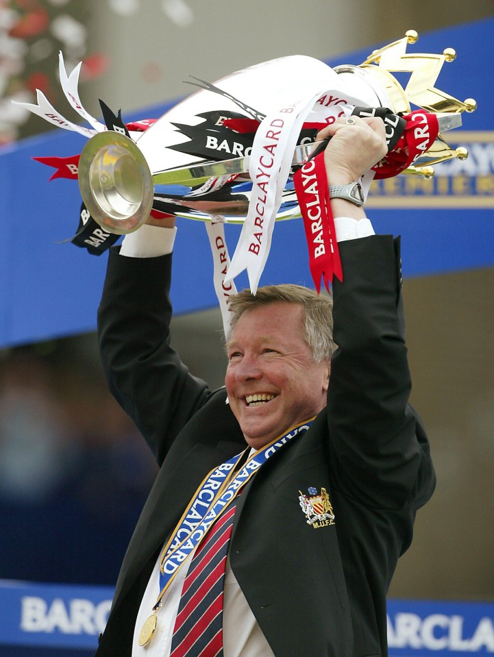 Sir Alex Ferguson holds the Premier League trophy aloft in 2003