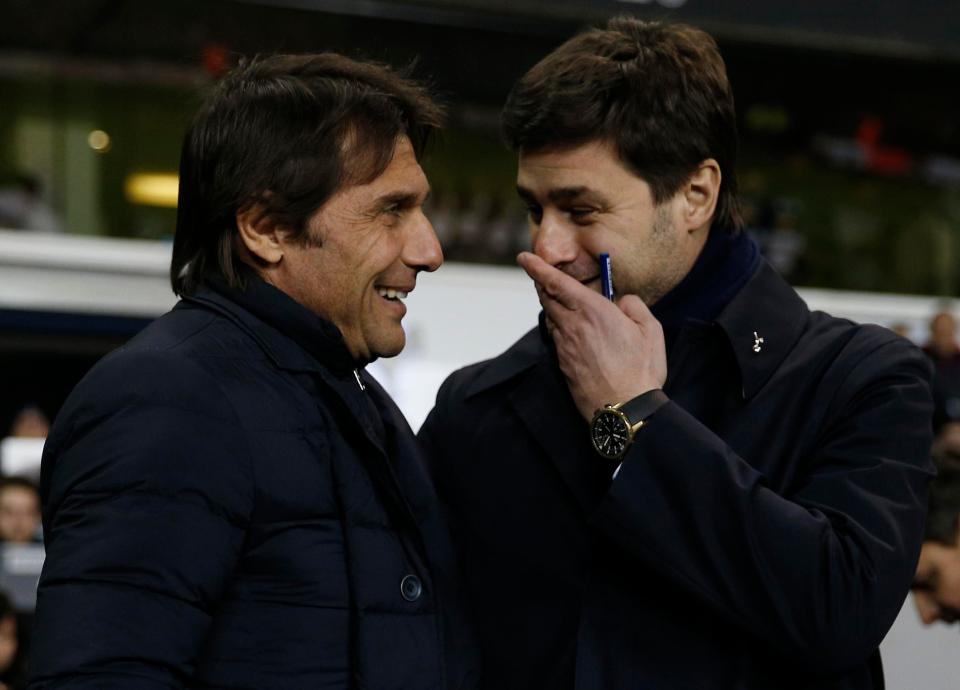 Conte and Poch share a joke during a Premier League match